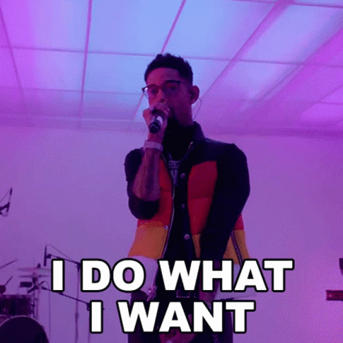 Man Singing I Do What I Want into Microphone