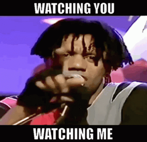 Man Singing Into Mic Watching You Watching Me
