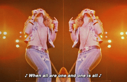 Man Singing Into Mic When All Are One And One Is All