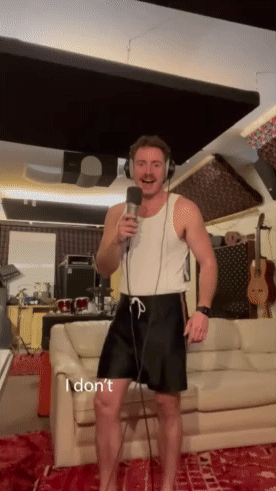 Man Singing Into Microphone