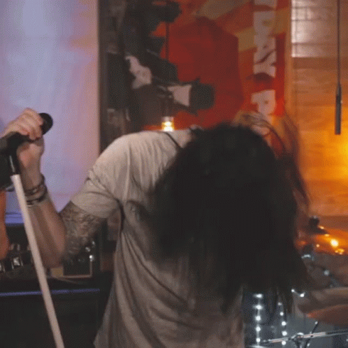 Man Singing Into Microphone GIF