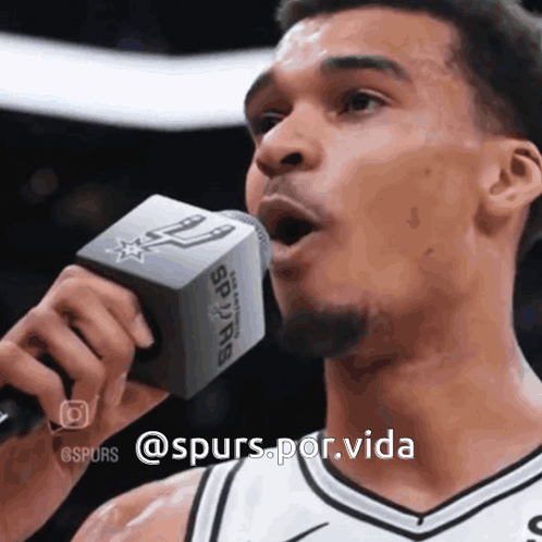 Man Singing Into Microphone