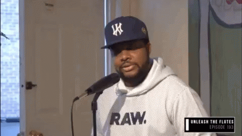 Man Singing Into Microphone