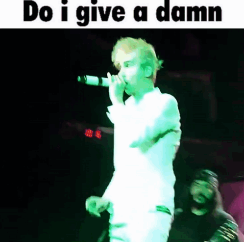 Man Singing Into Microphone Do I Give a Damn