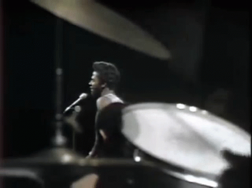 Man Singing Into Microphone Drums GIF