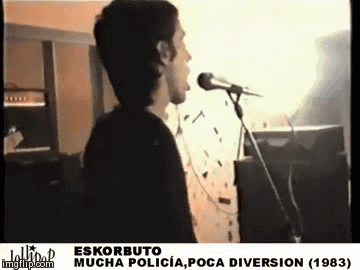 Man Singing Into Microphone Eskorbuto Mucha Policia Poca Diversion