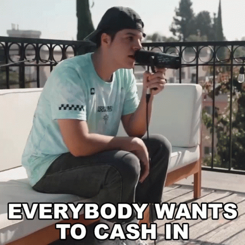Man Singing Into Microphone Everybody Wants to Cash In