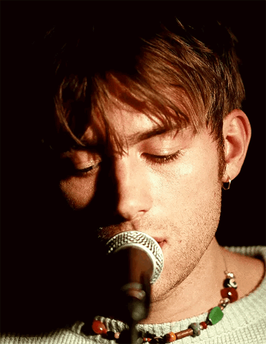 Man Singing Into Microphone Eyes Closed GIF