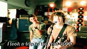 Man Singing Into Microphone I Took A Trip To The Year 3000 GIF