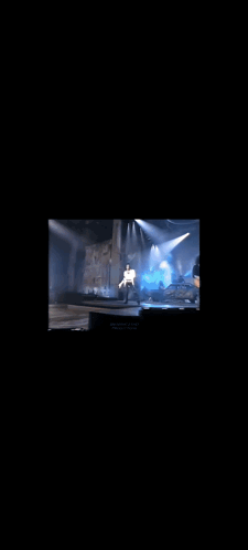 Man Singing Into Microphone In White Shirt GIF