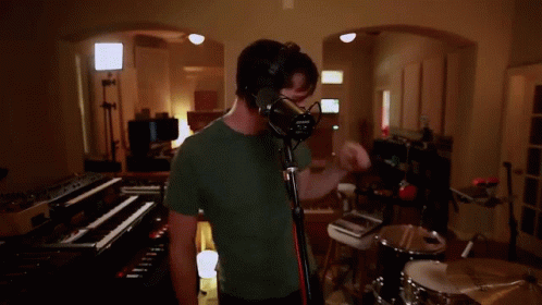 Man Singing Into Microphone GIF