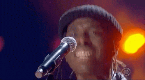 Man Singing Into Microphone