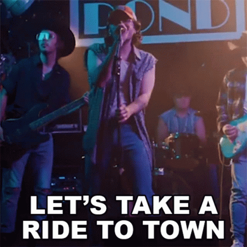 Man Singing Into Microphone Let's Take a Ride to Town