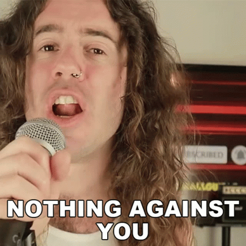 Man Singing Into Microphone Nothing Against You