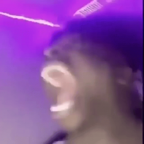 Man Singing Into Microphone Playing Drums