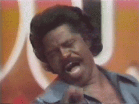 Man Singing Into Microphone