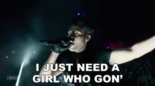 Man Singing Into Microphone Saying I Just Need a Girl Who Gon