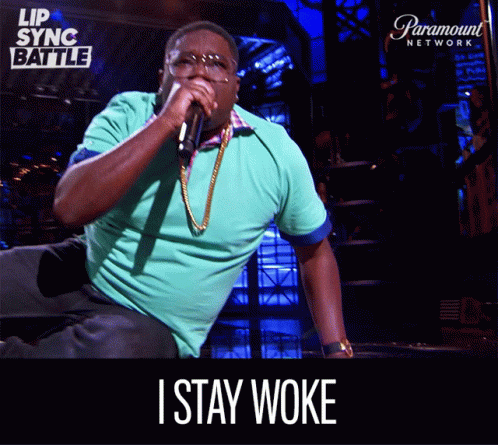 Man Singing Into Microphone Saying I Stay Woke