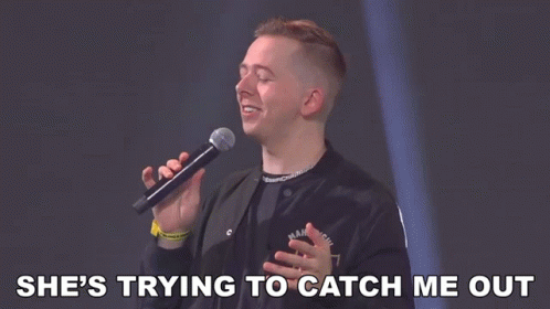 Man Singing Into Microphone Saying She's Trying to Catch Me Out
