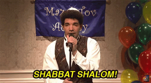 Man Singing Into Microphone Says Shabbat Shalom