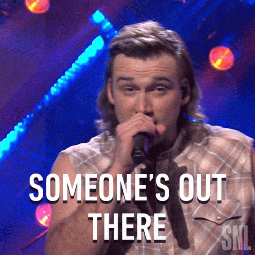 Man Singing Into Microphone Someone's Out There