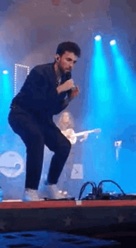 Man Singing Into Microphone GIF