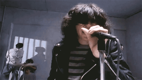 Man Singing Into Microphone