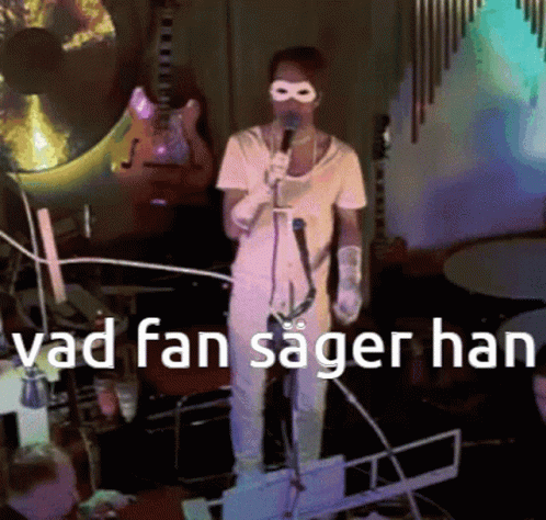 Man Singing Into Microphone Vad Fan Sager Han