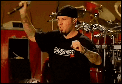 Man Singing Into Microphone Wearing DS Side Co Shirt GIF
