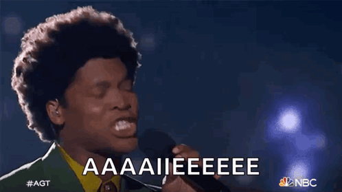 Man Singing Into Microphone with Aaaii Eeeee