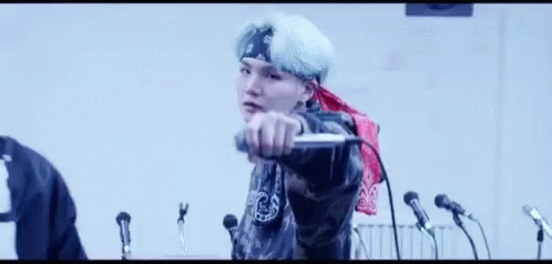 Man Singing Into Microphone With Bandana GIF