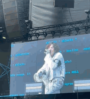 Man Singing Into Microphone With Blocks Screen GIF