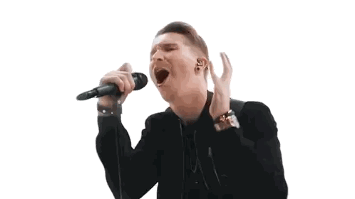 Man Singing Into Microphone With Earbuds