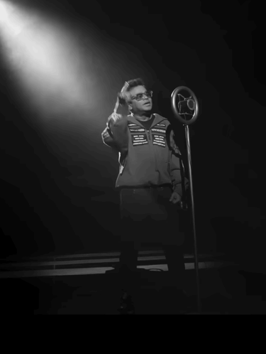 Man Singing Into Microphone With Euaam Maarum