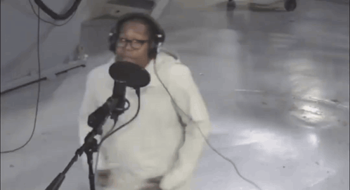 Man Singing Into Microphone With Headphones GIF