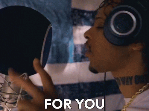 Man Singing Into Microphone With Headphones For You
