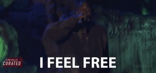 Man Singing Into Microphone With I Feel Free GIF