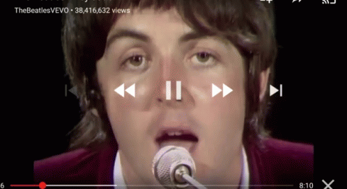 Man Singing Into Microphone Woman Playing Piano