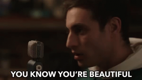 Man Singing Into Microphone You Know You're Beautiful