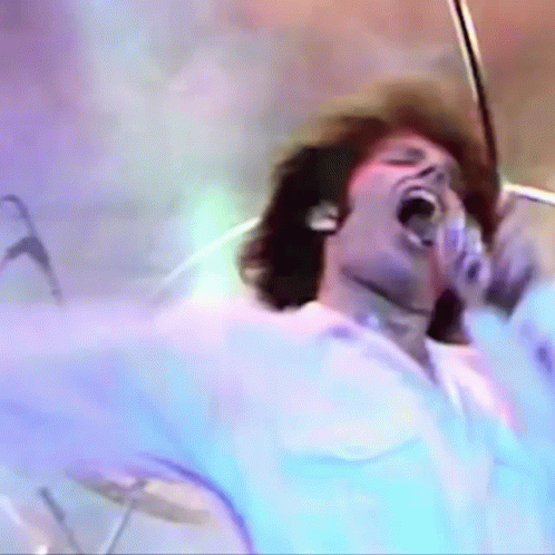 Man Singing Into Microphone