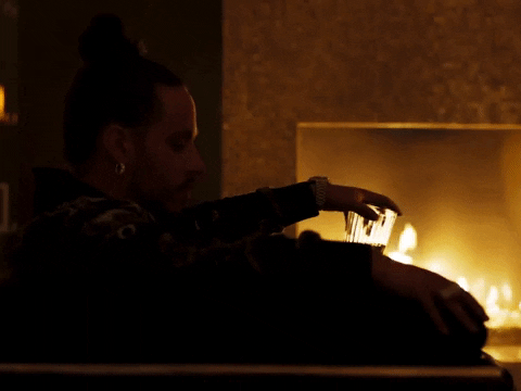 Man Singing Near Fireplace GIF