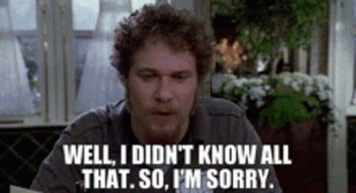 Man Sitting At A Table Saying Well I Didn't Know All That So I'm Sorry GIF