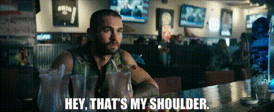 Man Sitting At Bar Saying Hey That's My Shoulder GIF