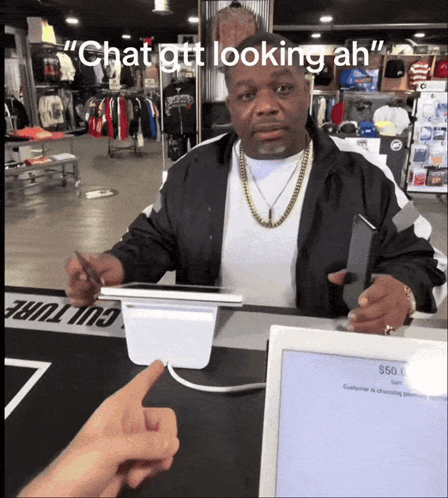 Man Sitting at Counter Chat Gtt Looking Ah