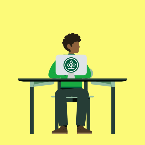 Man Sitting At Desk Holding Laptop With Green Logo GIF