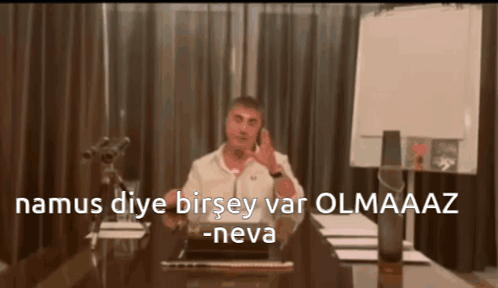 Man Sitting at Desk Talking on Cell Phone namus diye birsey var olmaaz -neva