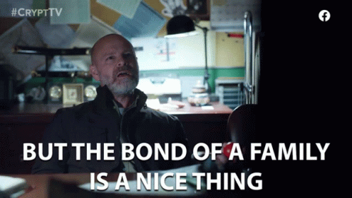 Man Sitting at Desk With But the Bond of a Family Is a Nice Thing