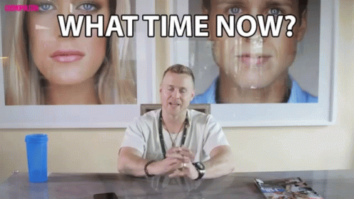 Man Sitting at Desk With What Time Now
