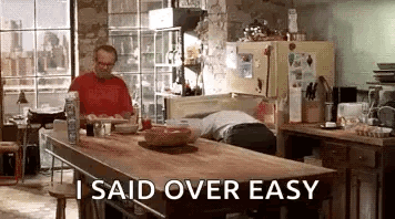Man Sitting At Kitchen Table Saying Over Easy GIF