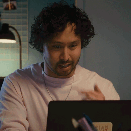 Man Sitting at Laptop With Dia Sticker